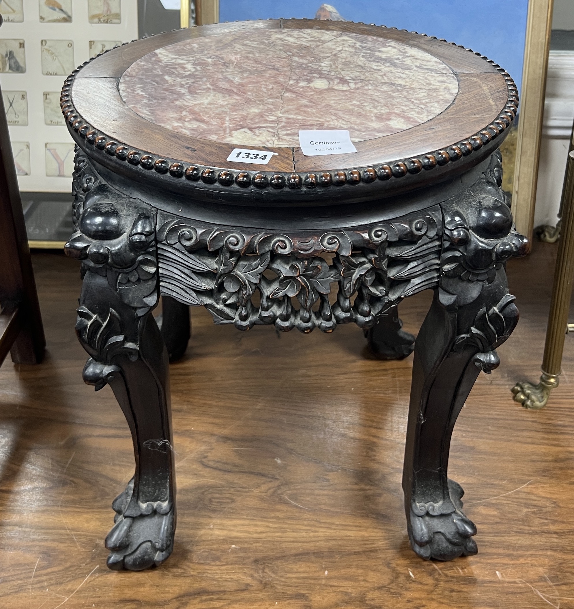 A Chinese circular hongmu and marble top vase stand, width 50cm, height 46cm